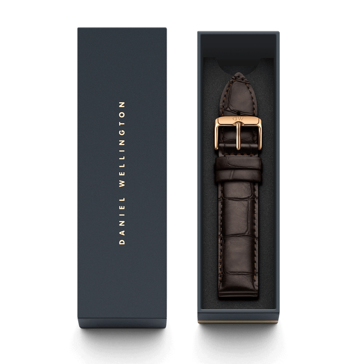 Daniel Wellington York Strap ローズゴールドのパッケージ画像です。ネイビーのブランドロゴ入りボックスの蓋と、クロコダイル型押しのダークブラウンレザーストラップが収められた本体が並べて配置されています。ギフトにもぴったりな上品な仕様です。
