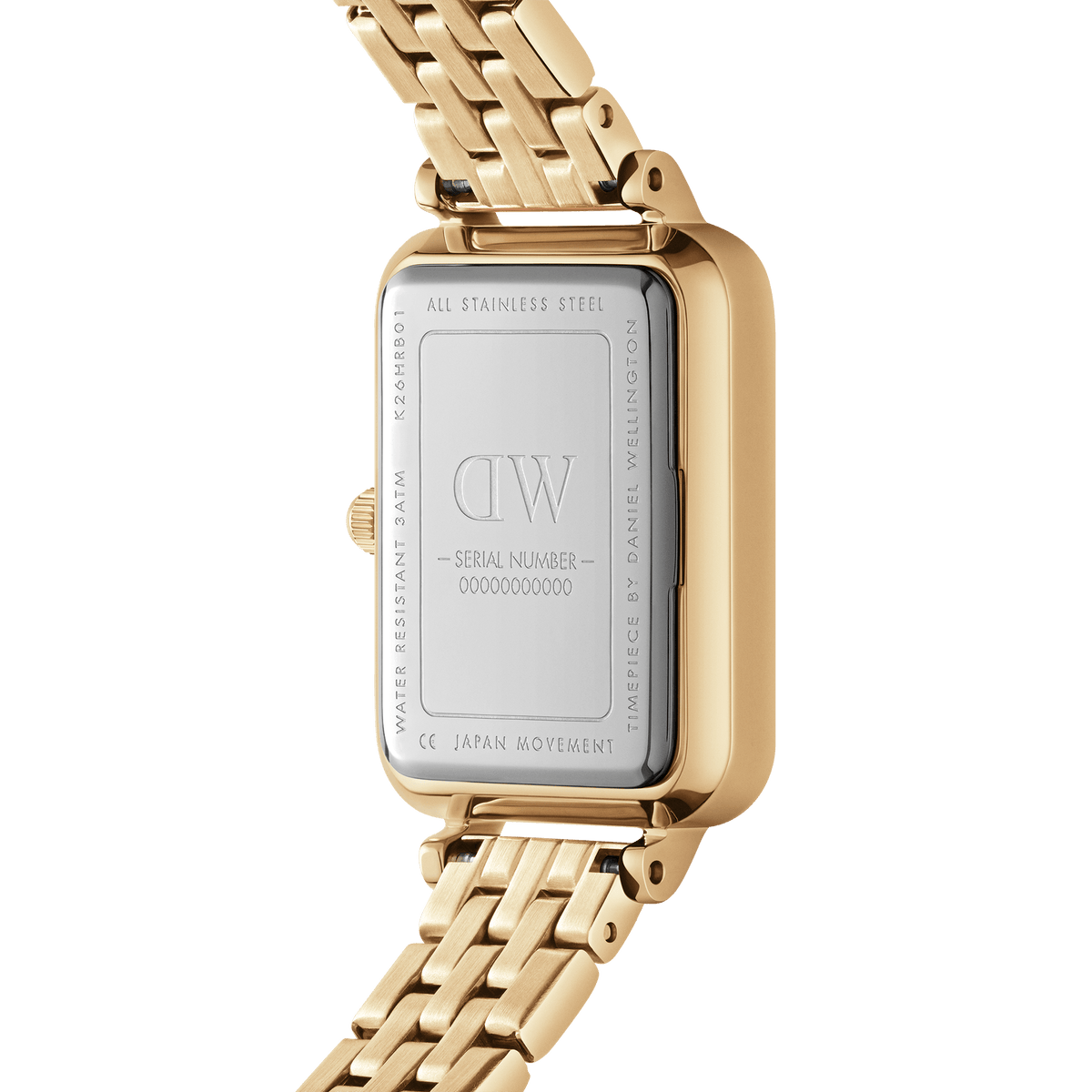 Quadro Roman Numerals 5-Link Goldのケースバックを撮影した画像です。ステンレススチール製の裏蓋にはDaniel Wellingtonのロゴやシリアルナンバー、3ATM防水表記が刻印されており、ゴールドのレクタンギュラーケースと5リンクブレスレットの仕上がりをご確認いただけます。