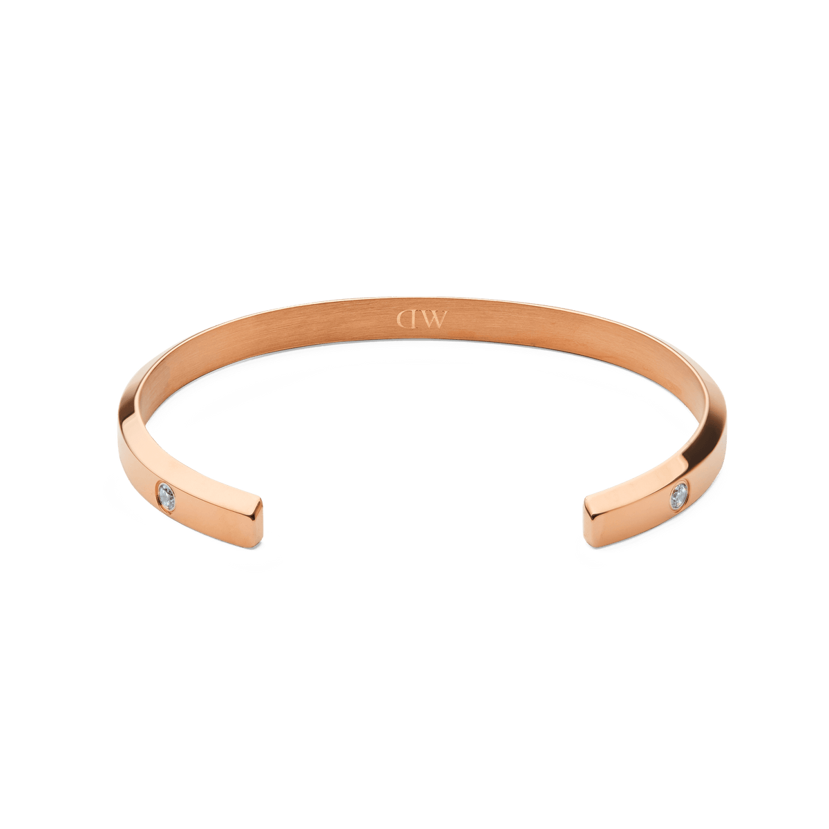 Classic Lumine Bracelet Rose Goldの内側を捉えたアングルの写真です。カフの内側に刻印されたブランドロゴと、両端にセットされたキュービックジルコニアが確認できるオープンカフデザインとなっています。