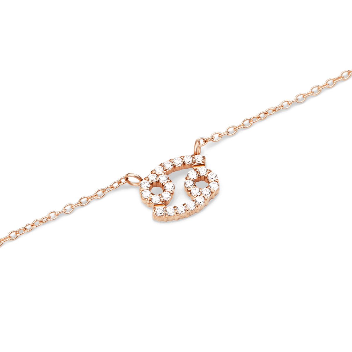 ダニエルウェリントン Crystal Zodiac Chain Necklaceのかに座ペンダント部分をクローズアップ。ローズゴールドの細身チェーンに、クリスタルで縁取られた蟹座のシンボルが繊細に輝きます。