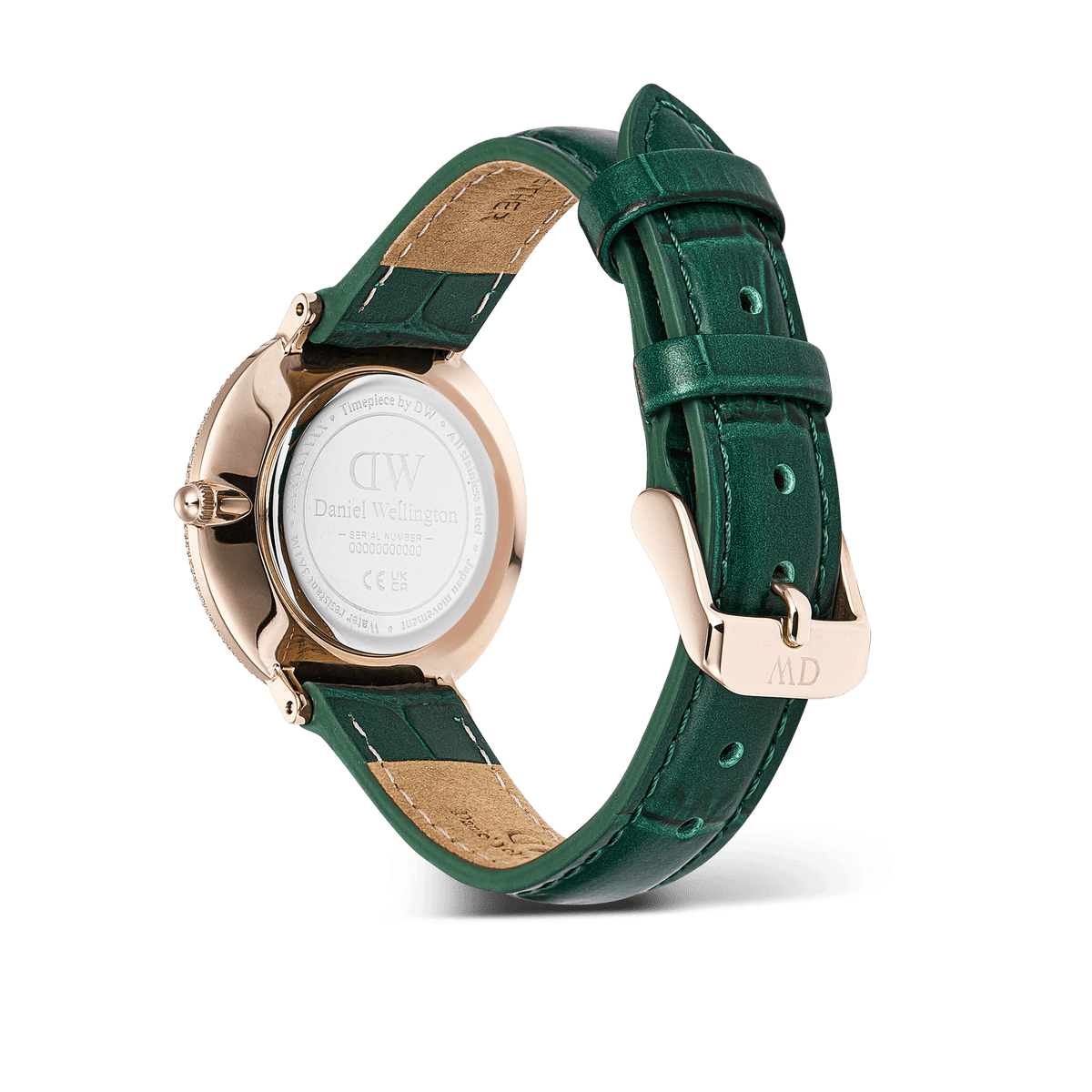 Crystalline Bezel Green Croc Rose Goldの裏蓋側からの商品画像です。Daniel Wellingtonのロゴが刻印されたケースバック、ローズゴールドのピンバックルにあしらわれたブランドイニシャル、グリーンのクロコダイル型押しレザーストラップの内側に使用されたベージュレザーとステッチの細やかな仕上がりがご覧いただけます。