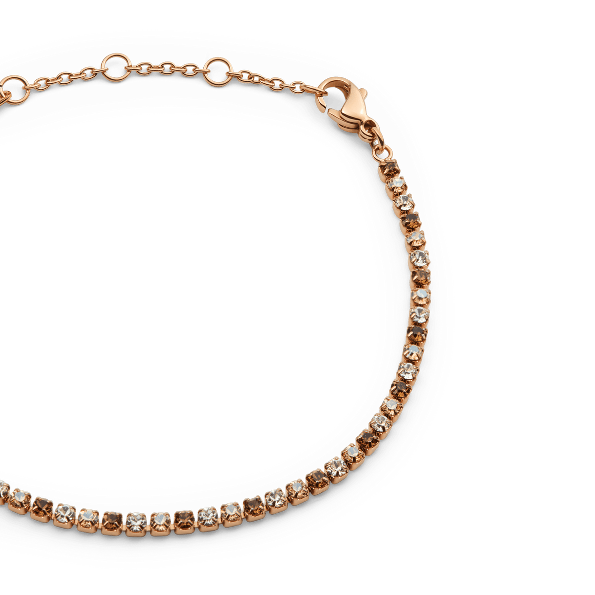 Daniel Wellington Classic Tennis Bracelet Honey Combo Rose Goldのクローズアップ画像です。ハニーとクリアのクリスタルが一粒ずつ爪留めされた細部や、ローズゴールドのアジャスターチェーン、ロブスタークラスプのディテールがご覧いただけます。