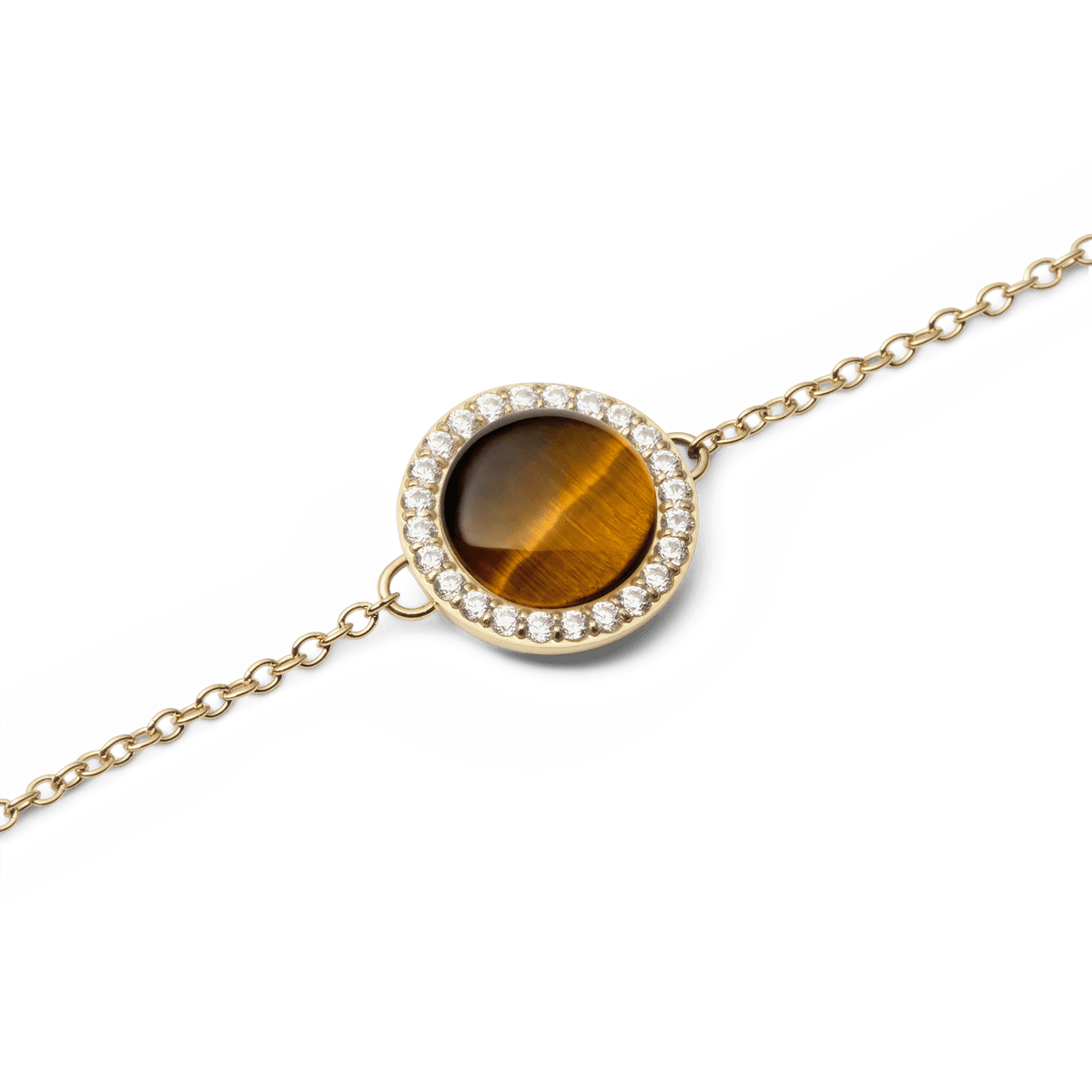 Audrey Bracelet Tiger Eye Goldのカボションカット部分をクローズアップした画像です。蜂蜜色から深いブラウンへと変化する絹のような縞模様が、光を受けて美しく輝きます。周囲を囲むキュービックジルコニアのヘイローとゴールドチェーンが、上品に調和しています。