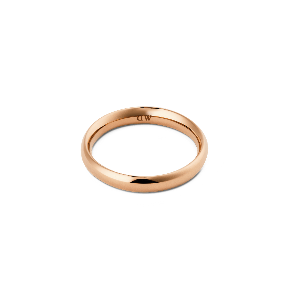 Arch Ring Rose Gold 3.5mmを正面やや上から撮影した画像です。内側にはDaniel Wellingtonの刻印が確認できます。角のない滑らかな曲面が光を受け、ローズゴールドの上品な輝きが白い背景に映えています。