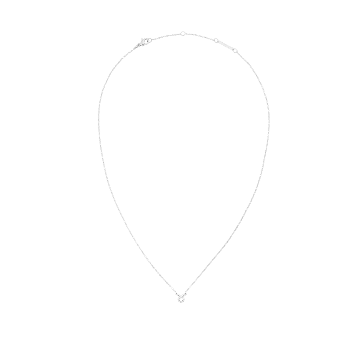 白背景で撮影した「Crystal Zodiac Chain Necklace Silver」の全体写真です。細身のシルバーチェーンがしずく型のシルエットを描き、中央下部にはおうし座をモチーフにした小ぶりなペンダントがクリスタルとともにセットされています。上部にはロブスタークラスプとブランドプレート付きのアジャスターが確認できます。