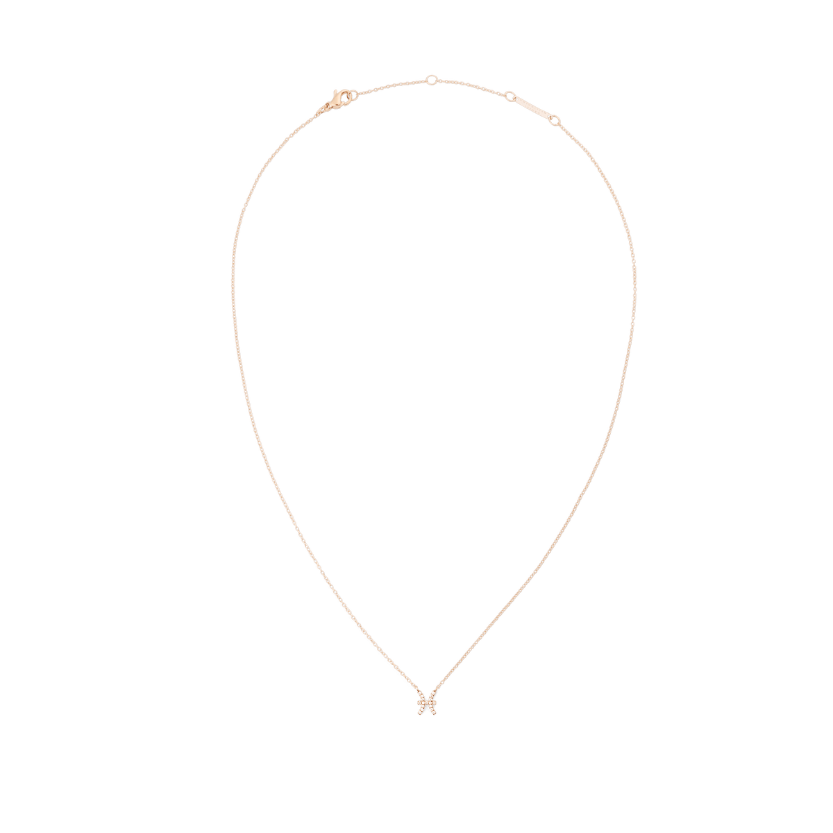 クリスタルZodiac Chain Necklaceのおひつじ座モデルを白背景で撮影した俯瞰写真です。ローズゴールドの繊細なチェーンが自然な雫型のシルエットを描き、下部にはクリスタルをあしらった小ぶりなおひつじ座のペンダントが配されています。上部にはロブスタークラスプとブランド刻印入りのエクステンションバーが確認できます。