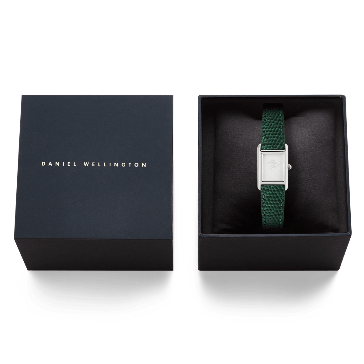 ダークネイビーのブランドギフトボックスに収められたBound Mini Green Lizard Silverの画像です。クッションの上に、グリーンのリザード型押しレザーストラップとシルバーケースの腕時計が丁寧にセットされています。贈り物にぴったりの上品なパッケージです。