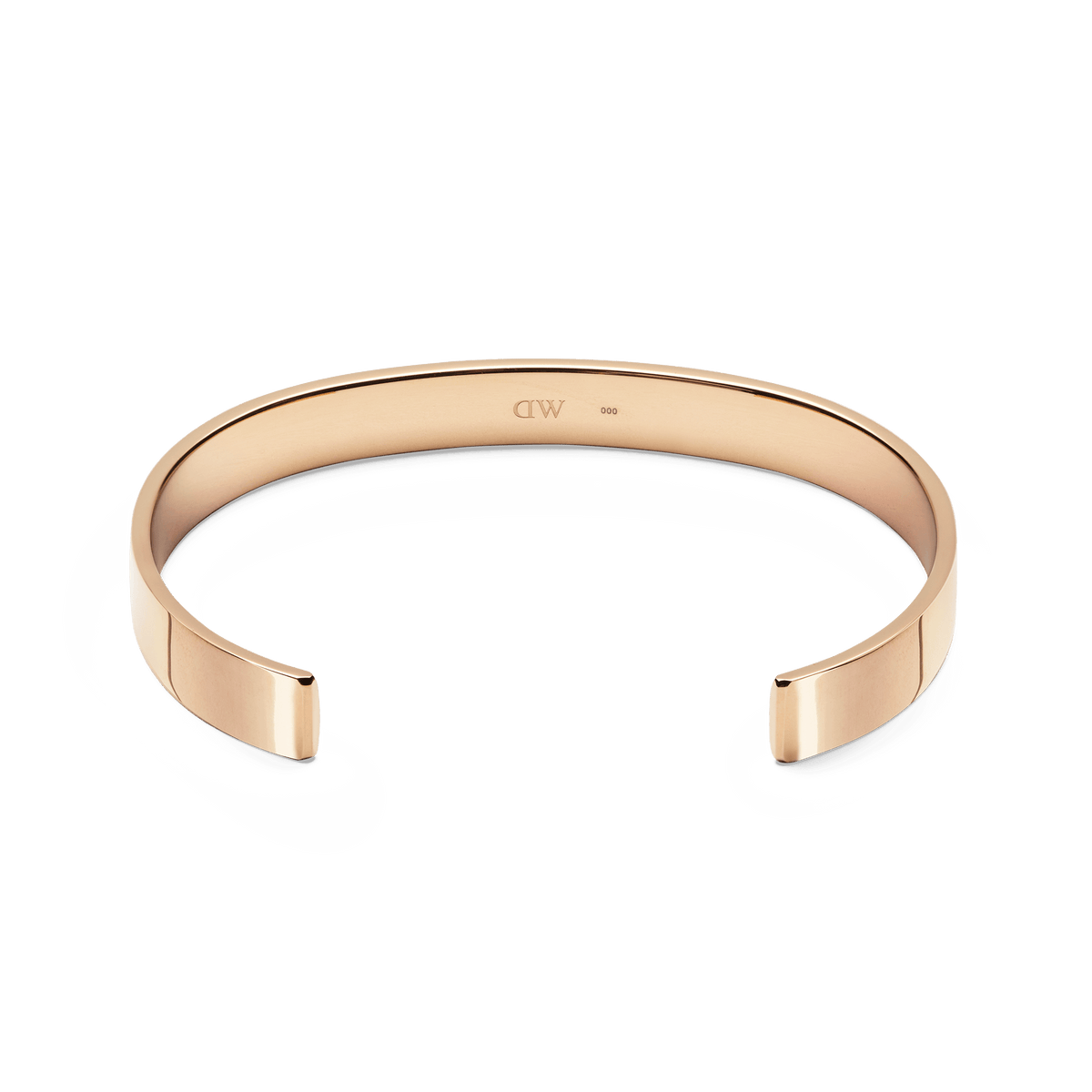 Line Cuff Polished Rose Goldの内側を捉えたアングル写真です。カフの内面にはDaniel Wellingtonのロゴが刻印されており、ポリッシュ仕上げのローズゴールドが上品な輝きを放っています。