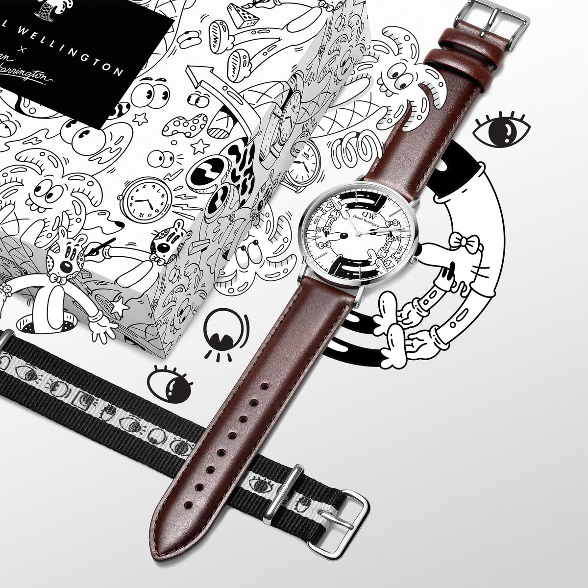 Steven Harrington × Daniel Wellingtonの限定コラボセット「フラットレイ」。シルバーケースにブラウンレザーストラップを組み合わせたアートダイヤルの腕時計が、アイモチーフのNATOストラップやイラスト入り専用パッケージとともにセットになっています。