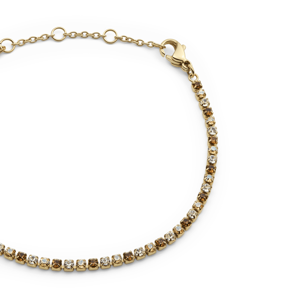 Classic Tennis Bracelet Honey Combo Goldのクローズアップ画像です。ハニーカラーとクリアのプレシオサ・ストーンが交互に爪留めされ、細身のチェーンとゴールドのアジャスターチェーン部分が美しく映えています。