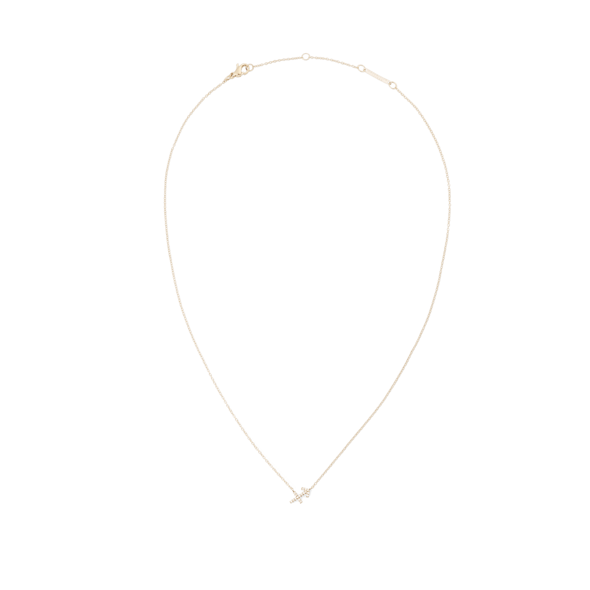 白背景に撮影された、射手座モチーフのCrystal Zodiac Chain Necklace Goldの全体像です。繊細なゴールドチェーンが優美なループを描き、下部にはクリスタルで形作られた射手座の矢のペンダントがあしらわれています。上部にはロブスタークラスプとアジャスターリングが付いています。