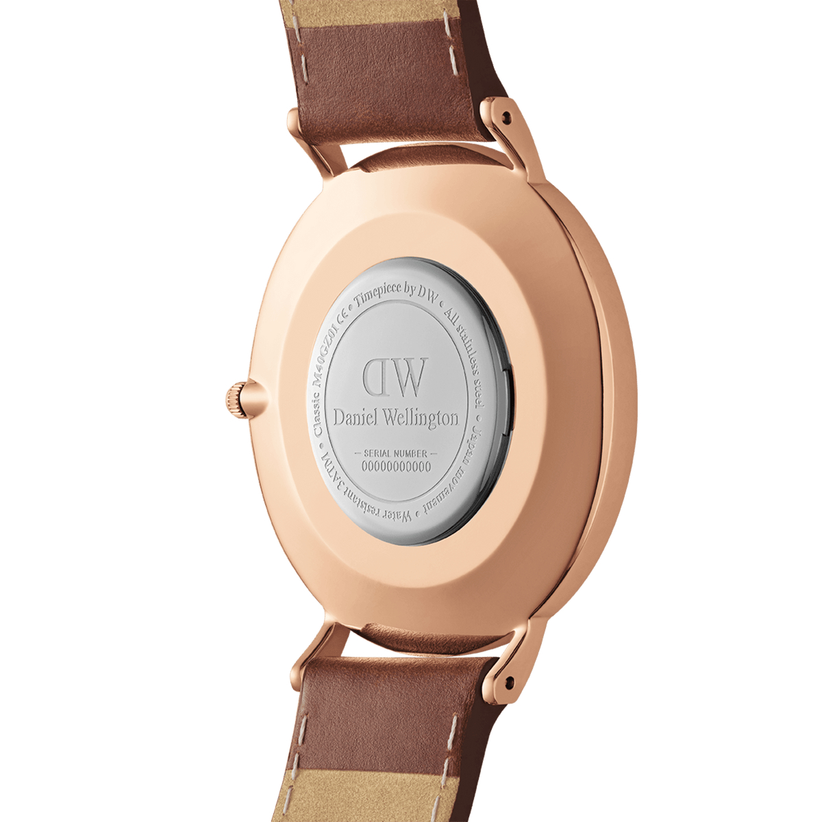 Classic St Mawes Amber Rose Goldのケースバックを撮影した画像です。ローズゴールドのPVDメッキ加工を施したケースには、Daniel Wellingtonのロゴとシリアルナンバーが刻印されており、ブラウンレザーストラップのラグ接続部分も確認できます。