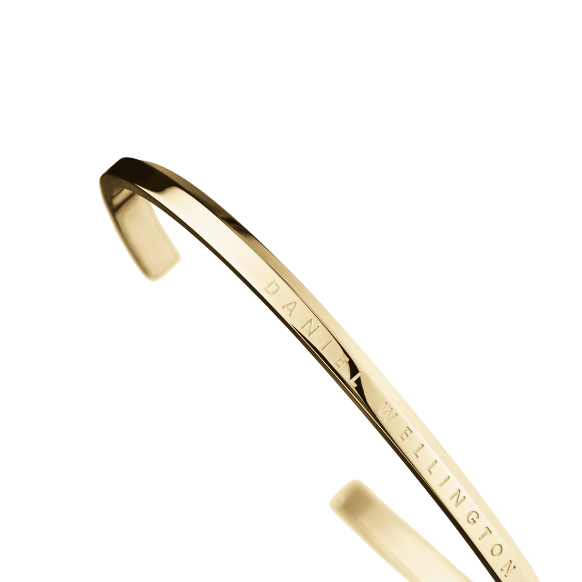 クラシックブレスレット Goldを側面から捉えた画像です。ポリッシュ加工のゴールドの輝きと、細身のシルエットが際立ち、側面にはDaniel Wellingtonのロゴが刻印されています。