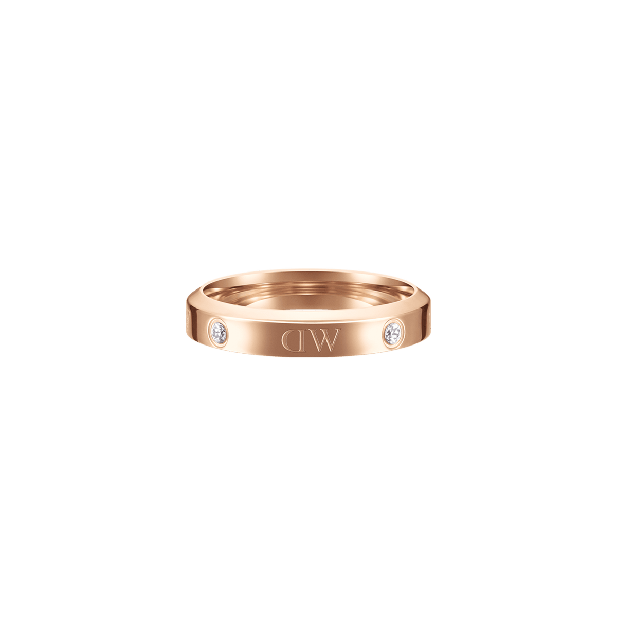Classic Lumine Ring Rose Goldを正面から捉えたクローズアップ画像です。リングの中央にはエッチングされたロゴが、その両側にはフラットに埋め込まれたクリスタルが輝いています。