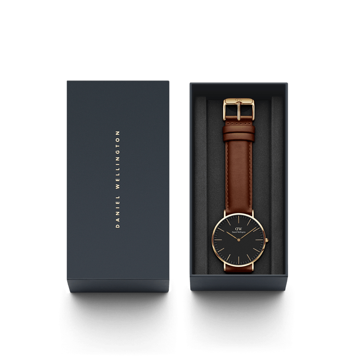 Daniel WellingtonのClassic St Mawesが、ネイビーの専用ギフトボックスに収められています。ブラック文字盤とブラウンレザーストラップの腕時計が丁寧にセットされており、贈り物にも最適なパッケージです。