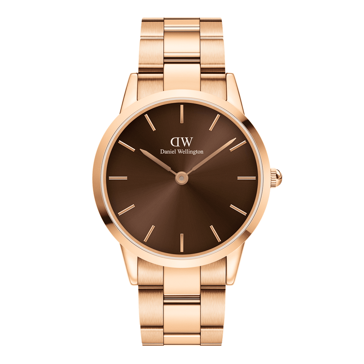 Daniel Wellington Iconic Link Amberを正面から捉えた商品画像です。アンバーカラーのサンレイ文字盤は中心から深いブラウンへと広がり、ローズゴールドの細身の針とバーインデックスが落ち着いた色調の中で控えめながら存在感を放っています。ケース右側にはローズゴールドのリューズが配置され、ポリッシュとサテン仕上げを組み合わせたリンクブレスレットが上下に伸びる構図となっています。