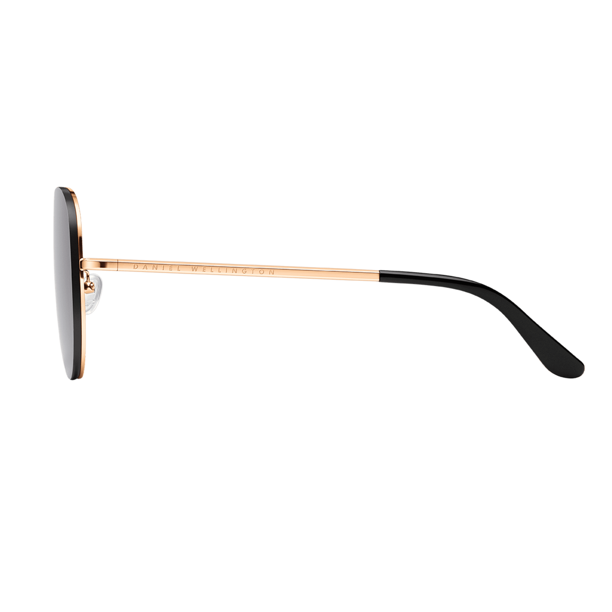 Avion Steel Rose Goldサングラスを側面から捉えた商品画像です。ローズゴールドのテンプルにはDaniel Wellingtonのロゴが刻印され、ブラックの酢酸セルロース製テンプルチップと透明なシリコン製ノーズパッドが確認できます。