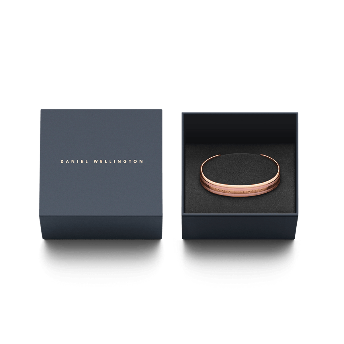 ダニエルウェリントンのEmalie Bracelet Dusty Rose Rose Goldは、ネイビーのギフトボックスに収められています。箱の蓋にはブランドロゴが箔押しされ、ブラックのクッショニングの上にブレスレットが丁寧にセットされており、贈り物に最適な上品なパッケージです。
