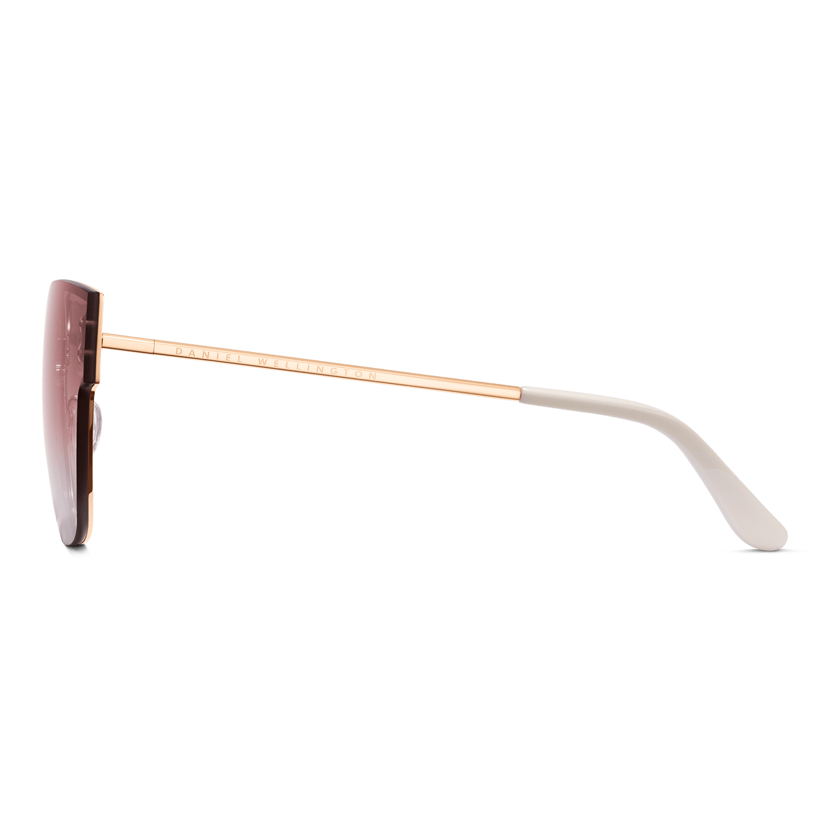 Grande Steel Pink Gradient Rose Goldのサイドビューです。ローズゴールドのテンプルにはDaniel Wellingtonのロゴが同系色で刻印されており、先端のクリーム色アセテート製テンプルチップと透明なシリコン製ノーズパッドが確認できます。
