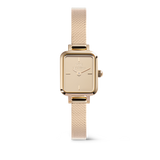 Daniel Wellington Quadro Mini Reflection Rose Goldの正面画像。ローズゴールドのポリッシュ加工を施したスクエアケースにミラーダイヤルを搭載し、細かく編み込まれたメッシュストラップまでワントーンで統一したミニサイズの腕時計です。