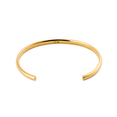 Arch Cuff Gold 4mmを内側から捉えたアングルの画像です。ポリッシュ加工のゴールドの美しい曲線と、内側に刻印されたDaniel Wellingtonのロゴが確認できます。