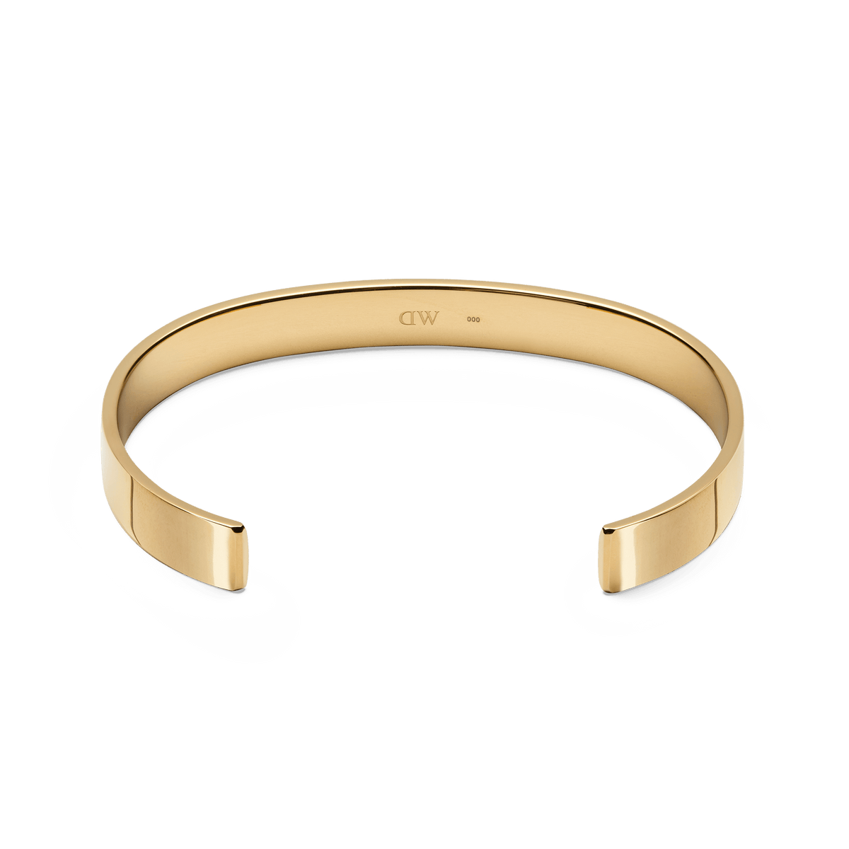 Line Cuff Polished Goldの内側を捉えたアングルです。カフの内側中央には控えめに刻印されたロゴが確認でき、ポリッシュ仕上げのゴールド表面が上品な光沢を放っています。