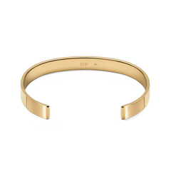 Line Cuff Polished Goldの内側を捉えたアングルです。カフの内側中央には控えめに刻印されたロゴが確認でき、ポリッシュ仕上げのゴールド表面が上品な光沢を放っています。
