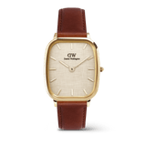 Daniel WellingtonのMarlon St Mawes Linen Goldを正面から撮影した画像です。丸みを帯びたクッションケースにゴールドの仕上げを施し、リネン織りのテクスチャーが特徴的なダイヤルとブラウンのレザーストラップを組み合わせた、ヴィンテージ感あふれる腕時計です。