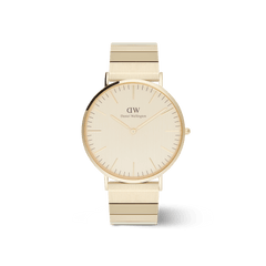 Classic Piano Link Gold Unitoneを白背景で正面から撮影した商品画像です。40mmのゴールドケースとブラッシュド仕上げのゴールドダイヤルが調和し、ピアノリンクストラップのブロック状のリンクが規則的に並ぶデザインが確認できます。