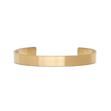 Daniel Wellington Line Cuff Brushed Goldの正面からのプロダクト画像です。マットな光沢が上品な、ブラッシュド加工のフラットゴールドバンドを使用したミニマルデザインのオープンカフブレスレットです。