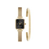 Daniel WellingtonのQuadro Mini Evergold Onyxは、ゴールドメッシュストラップの腕時計とClassic Braceletゴールドカフのセットです。スクエア型のオニキスブラック文字盤にゴールドの針とバーインデックスが映え、ブランドロゴがあしらわれたオープンカフブレスレットとの組み合わせが魅力的です。