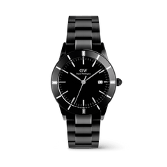 白背景に、Iconic Paradigma Link Blackを正面からやや斜めに撮影した全体像です。ブラッシュド仕上げとポリッシュ仕上げを組み合わせた3リンクブレスレットの質感や、ブラック文字盤に配されたシルバーのインデックス、ローレット加工のリューズが確認できます。