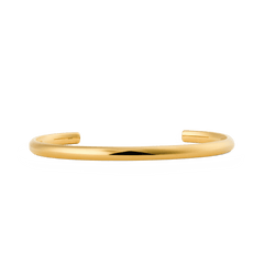 Daniel WellingtonのArch Cuff Gold 4mmを正面から撮影したプロダクト画像です。ポリッシュ仕上げのゴールドカフブレスレットが白い背景に映え、滑らかなアーチ形状とオープンカフのミニマルなデザインが際立ちます。