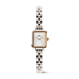 Daniel Wellington Quadro Mini Archのツートンカラーモデルです。ローズゴールドのレクタンギュラーケースに白い文字盤、シルバーとローズゴールドが交互に輝くアーチ型3リンクブレスレットが特徴の女性向け腕時計です。