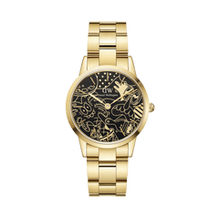 Steven Harrington x Daniel Wellington コラボレーション限定モデルのIconic Link デュアルトーンゴールド。ブラックの文字盤にヤシの木やキャラクターなどのゴールドラインアートが描かれ、サテンとポリッシュ仕上げの3リンクゴールドブレスレットをあしらったデザインです。