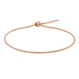 Daniel Wellington Charms Snake Bracelet ローズゴールドの全体を白背景で撮影した画像です。細身のスネークチェーンとスライド式の留め具が確認でき、チャームを取り付ける前のシンプルな状態となっています。