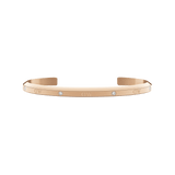 Daniel Wellington Classic Lumine Braceletのローズゴールドオープンカフ。ポリッシュ仕上げの表面にクリスタルとロゴが等間隔に配された、細身で上品なデザインです。