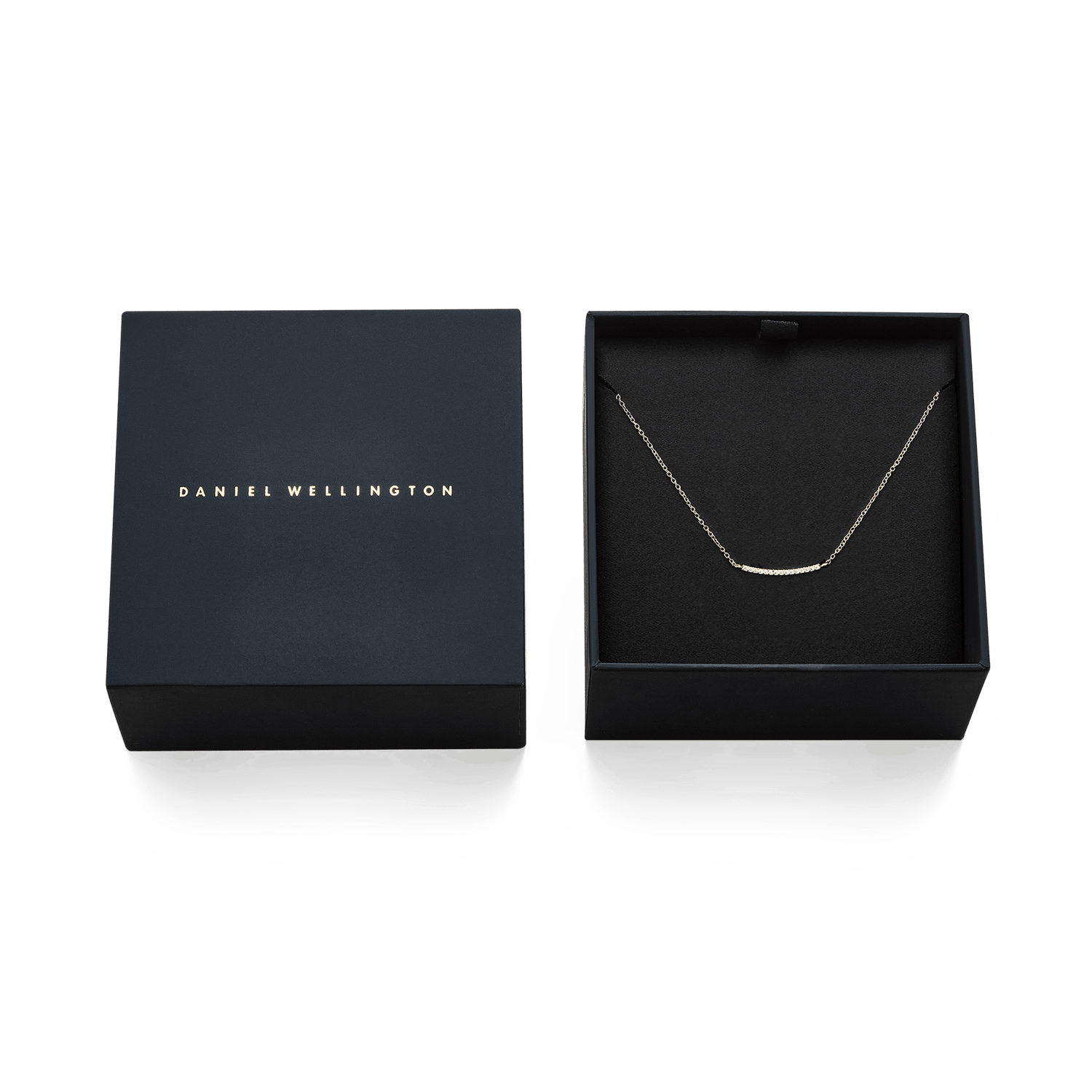ダニエルウェリントンのギフトボックスに収められたMirelle Eternity Necklace Goldです。ダークネイビーのボックスには蓋にブランドロゴがゴールドで刻印され、内側にはキュービックジルコニアが輝くゴールドネックレスが丁寧にセットされています。