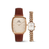 ダニエルウェリントンのMarlon & Jolie Chain ローズゴールド ペアウォッチセット。ブラウンレザーストラップをあしらったクッションケースのMarlonと、ローズゴールドのカーブチェーンストラップが特徴のコンパクトなスクエアケースのJolie Chainを並べたデザインです。