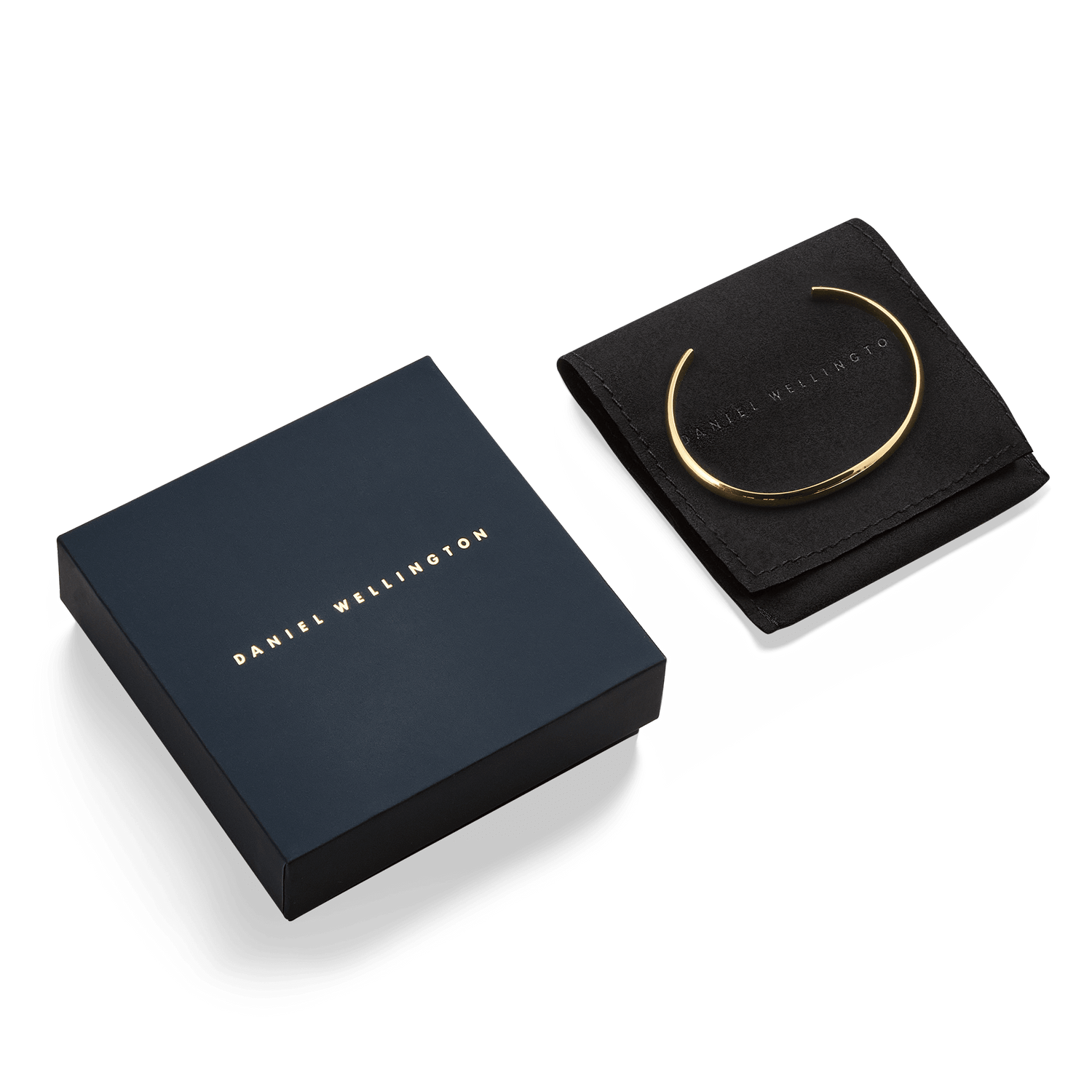 Arch Cuff Gold 6mmのギフトパッケージ画像です。ネイビーのブランドボックスとブラックのスエード調ポーチの上に、ゴールドのカフブレスレットが並んでいます。