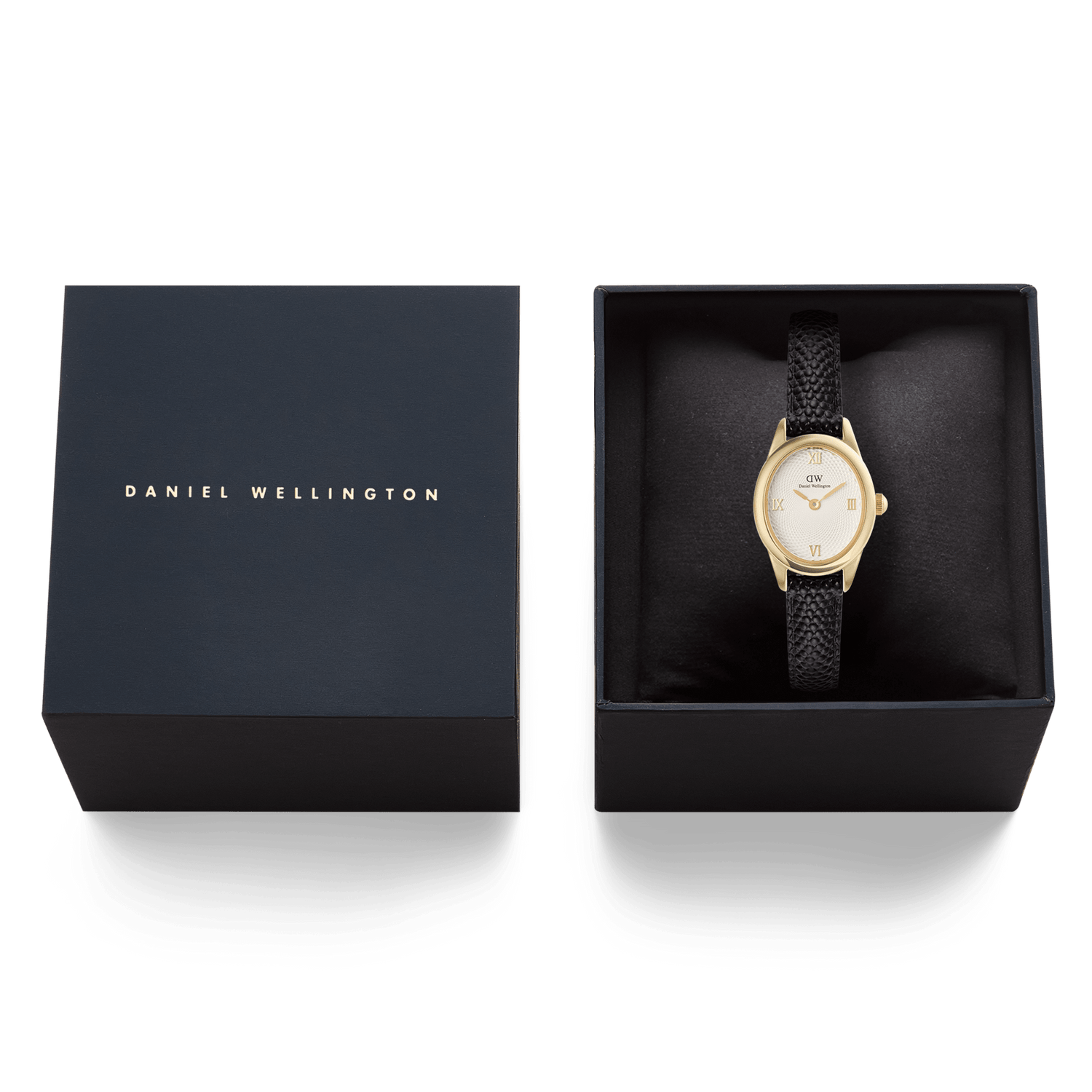 Ophelia Mini Black Lizard White Guilloché Goldが、ダークネイビーのブランドロゴ入りギフトボックスに収められた様子です。クッションの上にゴールドのオーバルケースとブラックリザード型押しのストラップが美しく映え、贈り物にぴったりの上品なパッケージングとなっています。