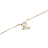 獅子座のシンボルをクリスタルで描いた**Crystal Zodiac Chain Necklace Gold**のペンダント部分です。白い背景に映えるゴールドの細身チェーンと、爪留めされたクリスタルの繊細な輝きが際立つディテールをご覧いただけます。