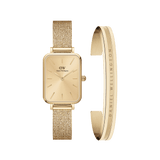 Daniel WellingtonのQuadro Pressed Unitone Goldは、ゴールドサンレイダイヤルとメッシュストラップの腕時計と、サテン仕上げのElan Braceletをセットにした商品です。ケース、ダイヤル、ストラップ、ブレスレットすべてがゴールドトーンで統一されています。