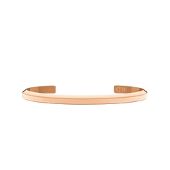 ローズゴールド仕上げのクラシックなブレスレット「Classic Bracelet Rose Gold」を正面から撮影した全体写真です。オープンカフの開口部が確認でき、右側の端にはDaniel Wellingtonのロゴが刻印されています。ミニマルなデザインが特徴です。