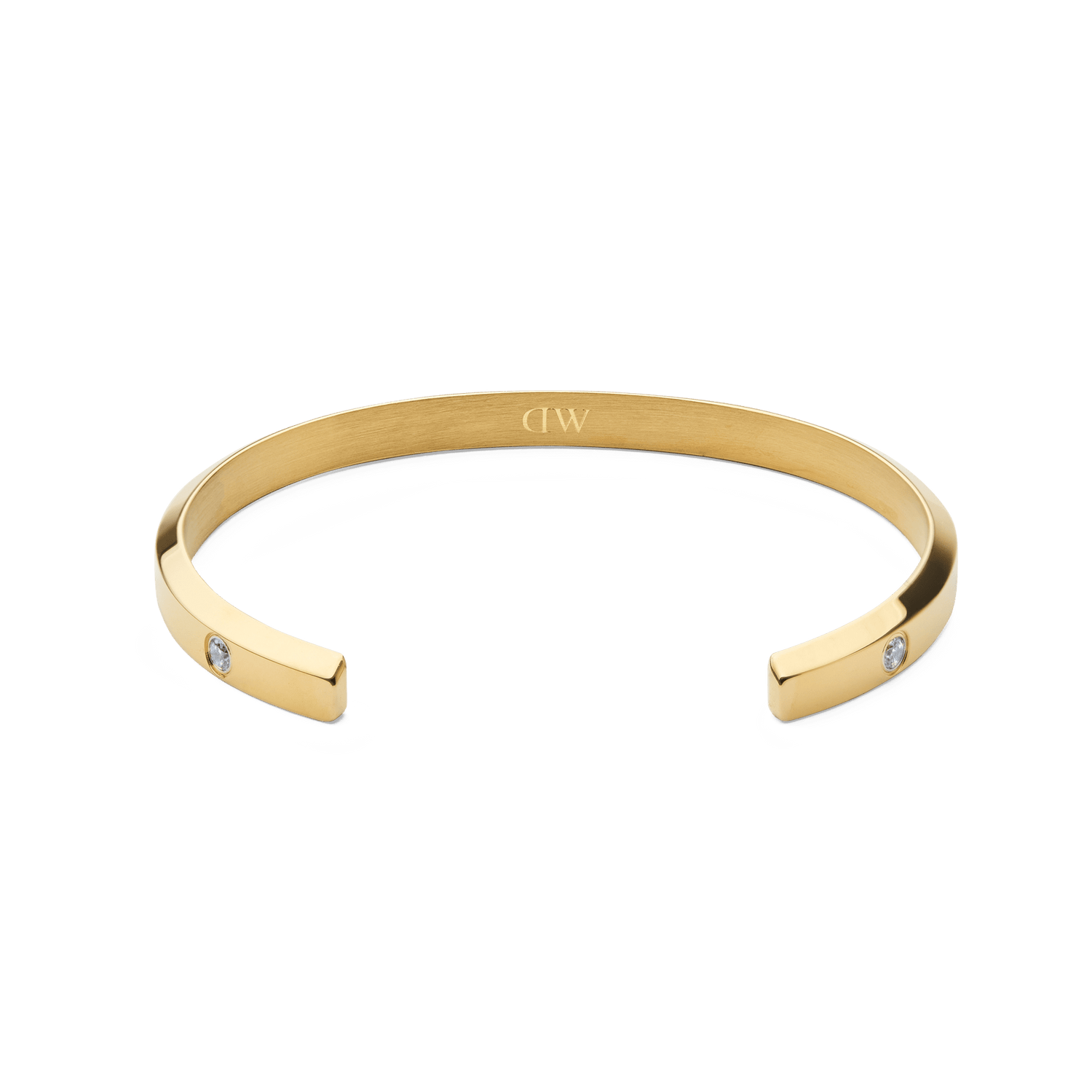 Classic Lumine Bracelet Goldの内側を捉えたアングルの画像です。カフの内側にはDaniel Wellingtonの刻印が施され、両端にはキュービックジルコニアがセットされています。