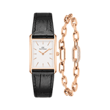 Daniel WellingtonのBoundウォッチとCrystal Link Braceletのローズゴールドセットです。レクタンギュラーケースにホワイトダイヤル、ブラックのクロコダイル型押しレザーストラップをあしらった腕時計と、パヴェセッティングのクリスタルが輝くローズゴールドチェーンブレスレットのセット商品です。