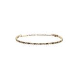 Daniel WellingtonのClassic Tennis Bracelet Honey Combo Goldは、ハニーカラーとクリアのストーンが交互に配置されたゴールドのテニスブレスレットです。ロブスタークラスプとサイズ調節用のチェーンが付いています。