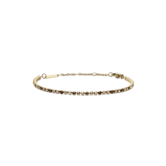Daniel WellingtonのClassic Tennis Bracelet Honey Combo Goldは、ハニーカラーとクリアのストーンが交互に配置されたゴールドのテニスブレスレットです。ロブスタークラスプとサイズ調節用のチェーンが付いています。