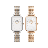 Daniel WellingtonのQuadro Lumine 5リンク2本セット。シルバー＆ゴールドのツートーン5連ブレスレットにホワイト文字盤を組み合わせたモデルと、ローズゴールド5連ブレスレットにマザーオブパール文字盤のMelroseモデルをセットにした、長方形ケースのレディース腕時計です。どちらもクリスタルインデックスをあしらった上品なデザインです。