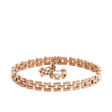 Daniel Wellingtonの3-Link Set Rose Goldを白背景で並べた商品写真です。ポリッシュ仕上げのローズゴールドカラーの3列リンクブレスレットの中央に、同じデザインのフープピアスが添えられています。